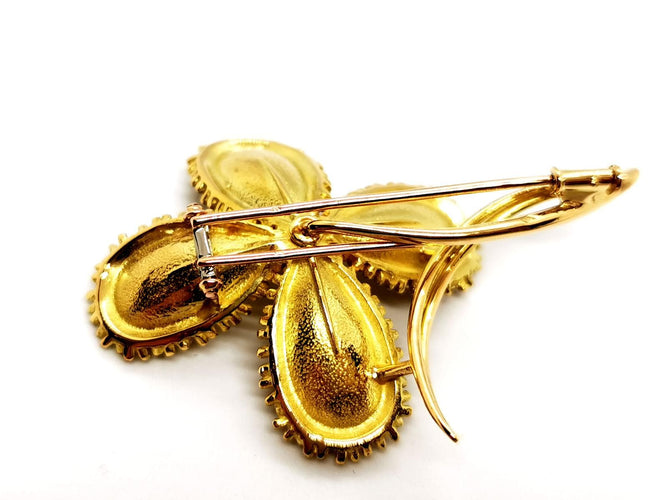Broche Broche fleur vintage en or jaune 18 carats rubis et diamants 58 Facettes 1089906CD