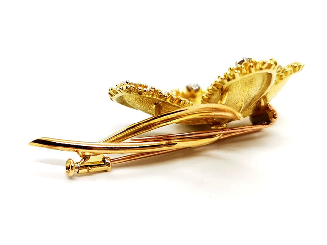 Broche Broche fleur vintage en or jaune 18 carats rubis et diamants 58 Facettes 1089906CD
