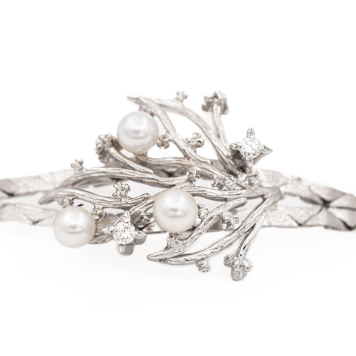 Bracelet Bracelet vintage motif feuillage en or blanc 18 carats, diamants et perles 58 Facettes 1142143CN