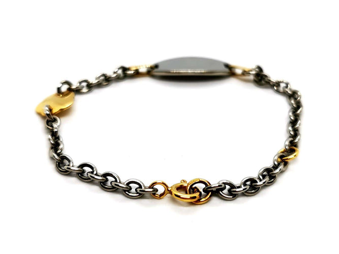 Bracelet Bracelet gourmette bébé bicolore en or jaune et or blanc 18 carats 58 Facettes 1180578CD