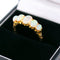 Bague 55 Bague cinq pierres en or jaune 18 carats et opales 58 Facettes 3613F170ED024DF7983473E9C4472394