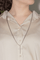 Collier Collier croix en or blanc 18 carats et diamants 58 Facettes 1752355CN
