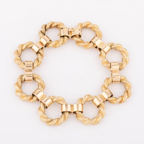 Bracelet Chaumet - Bracelet à anneaux torsadés en or jaune 18k 58 Facettes 1