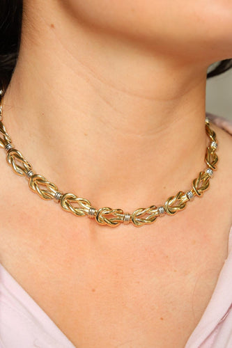 Collier Christofle - Collier motif nœud plat en or jaune et or blanc 58 Facettes 2238751CN