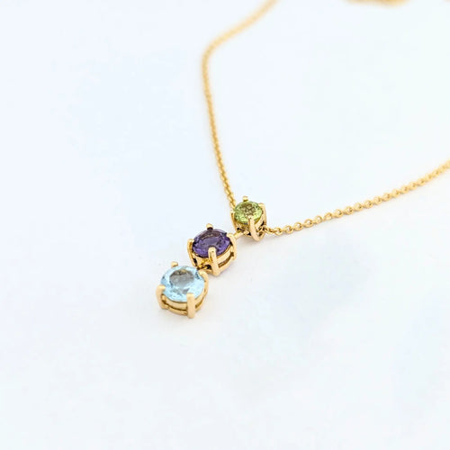 Collier Collier en or jaune 18 carats avec aigue-marine, améthyste et péridot 58 Facettes 31899