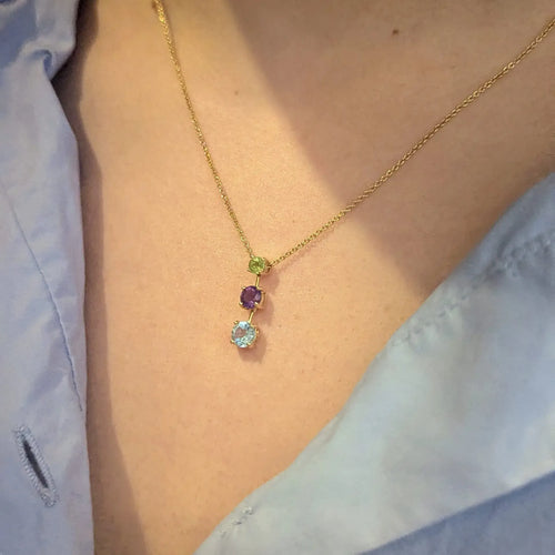 Collier Collier en or jaune 18 carats avec aigue-marine, améthyste et péridot 58 Facettes 31899