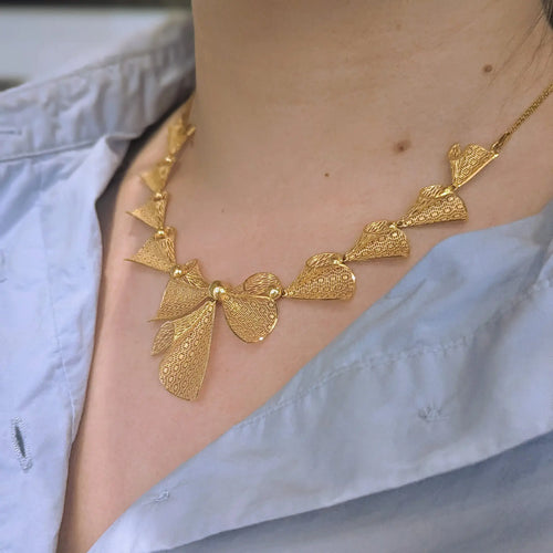 Collier Collier nœuds en or jaune 18 carats 58 Facettes 31901