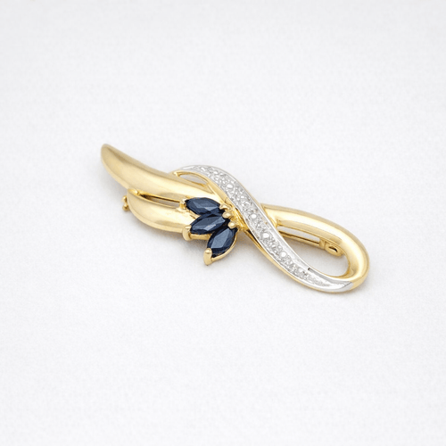 Broche Broche en or jaune 18 carats avec saphirs et diamant 58 Facettes 32262