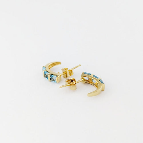 Boucles d'oreilles Boucles d’oreilles demi-lune en or jaune 18 carats et aigues-marines 58 Facettes 33685
