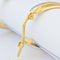 Boucles d'oreilles Créoles ovales torsadées en or blanc et jaune 18 carats 58 Facettes 33738