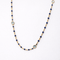 Collier Collier en or jaune 18 carats avec perles et topazes bleues 58 Facettes 34651