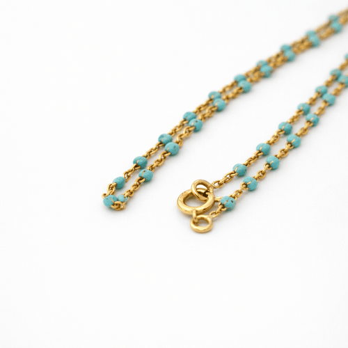 Collier Collier en or jaune 18 carats et perles turquoises 58 Facettes 34663