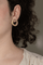 Boucles d'oreilles Dinh Van Cible - Boucles d’oreilles puces en or jaune et diamants 58 Facettes 4284535RV