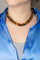 Collier Collier choker en or jaune et blanc 18 carats, œil-de-tigre et diamants 58 Facettes 4615473CN