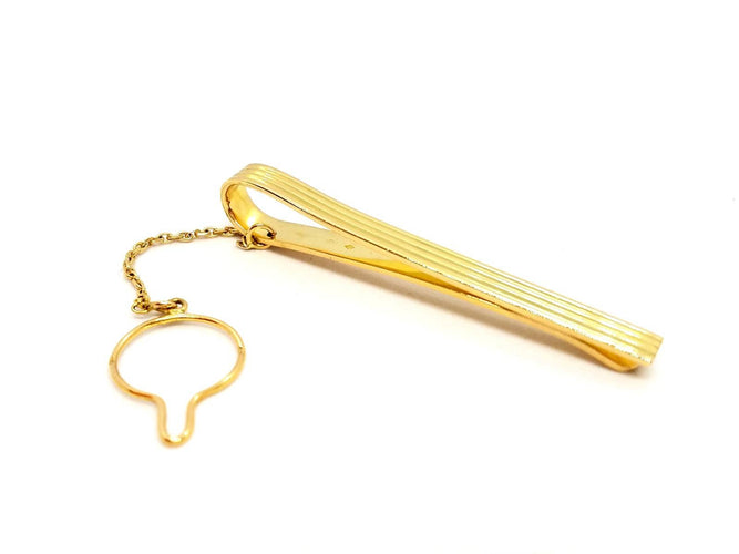 Broche Hermès - Pince à cravate en or jaune 18 carats 58 Facettes 720124CN