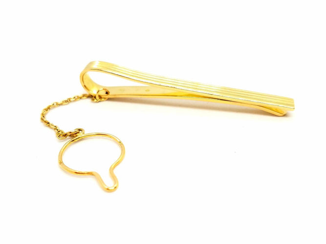 Broche Hermès - Pince à cravate en or jaune 18 carats 58 Facettes 720124CN