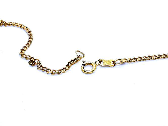 Collier Collier chaîne maille gourmette en or jaune 18 carats 58 Facettes 948044CD