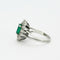 Bague 46 Bague marguerite or blanc, émeraude et diamants 58 Facettes DV0629-2