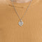 Pendentif POIRAY  "COEUR ENTRELACÉ". Pendentif en or gris 58 Facettes DDV7353-3