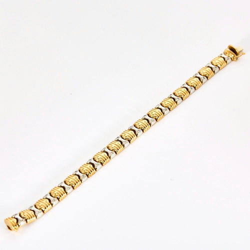 Bracelet Bracelet en or jaune, or gris et diamants 58 Facettes DV0984-6