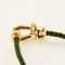 Bracelet FRED - FORCE 10 - Moyen modèle - Bracelet en or jaune et cordon torsadé en acier vert 58 Facettes DV18445-7