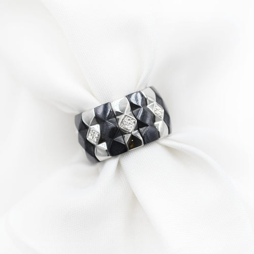 Bague Bague Enigma en or et acier 58 Facettes 8611