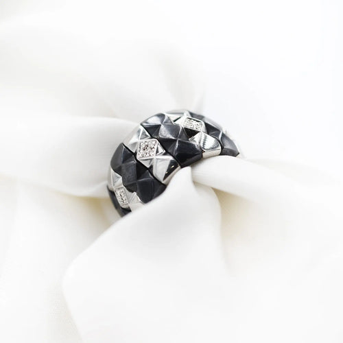 Bague Bague Enigma en or et acier 58 Facettes 8611
