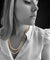 Collier Collier double rang de perles en or blanc 18 carats et saphirs 58 Facettes