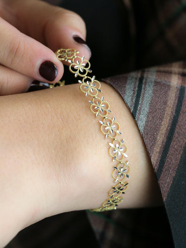 Bracelet Bracelet dentelle trèfle en or jaune et or blanc 18 carats 58 Facettes 1CA0000052/1