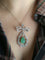 Collier Collier nœud Belle Époque en platine, émeraude et diamants 58 Facettes 1188.1