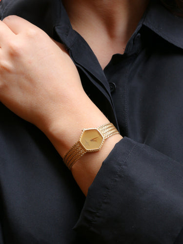 Montre Baume & Mercier - Montre vintage en or jaune 18 carats à maille tressée 58 Facettes 1067.3