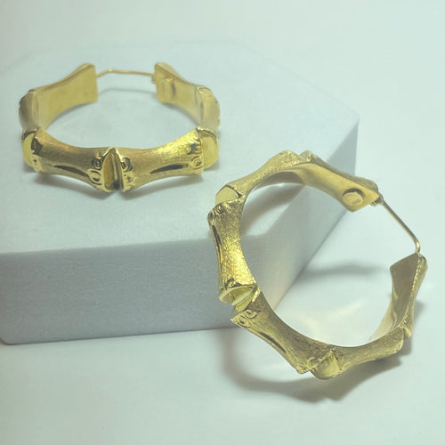 Boucles d'oreilles Boucles d’oreilles créoles bambou en or jaune 18 carats 58 Facettes 250094
