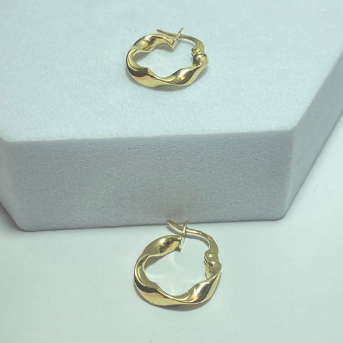 Boucles d'oreilles Boucles d’oreilles créoles torsadées en or jaune 18K 1,24 g 58 Facettes 250348