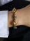 Bracelet Bracelet chaîne maille grain de café en or jaune 18 carats et agate 58 Facettes 1211.3