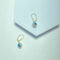 Boucles d'oreilles Boucles d’oreilles pendantes motif œil bleu en or jaune 14 ct 58 Facettes 250366