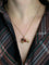 Pendentif Pendentif charm voiture ancienne en or jaune 18 carats, rubis synthétiques et émail 58 Facettes 1099.21