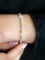 Bracelet Bracelet ligne en or blanc 18 carats avec citrines, péridots et topazes bleues 58 Facettes 1CA0000006/1