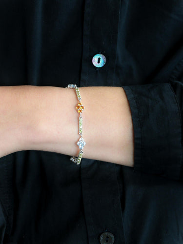 Bracelet Bracelet ligne en or blanc 18 carats avec citrines, péridots et topazes bleues 58 Facettes 1CA0000006/1