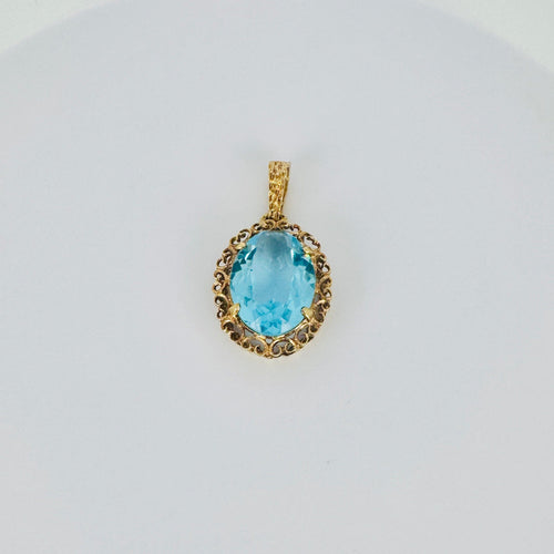 Pendentif Pendentif vintage en or rose 18 carats et topaze bleue 58 Facettes 2509003