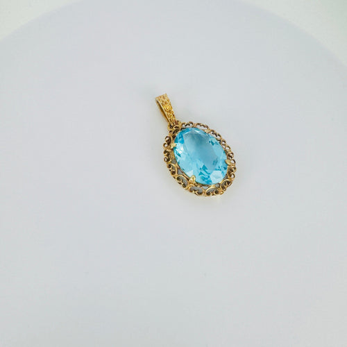 Pendentif Pendentif vintage en or rose 18 carats et topaze bleue 58 Facettes 2509003
