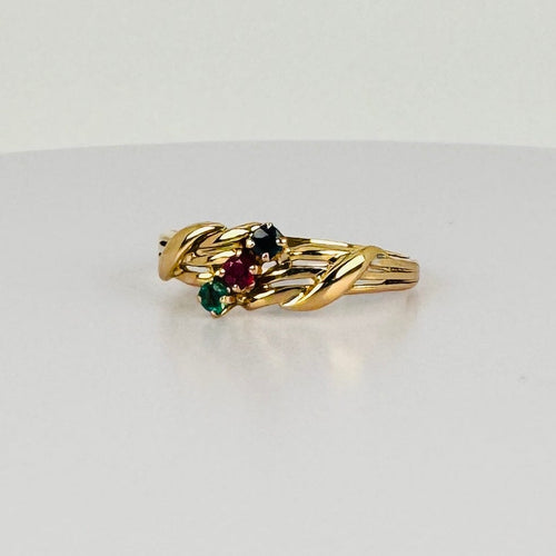 Bague Bague vintage en or jaune 18 ct avec rubis, émeraude et saphir bleu 58 Facettes 2505006