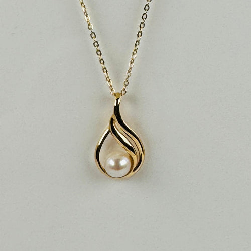 Pendentif Pendentif vintage en or jaune 18 carats et perle ronde 58 Facettes 2508018