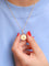 Pendentif Augis - Médaille Amour « Plus qu’hier, moins que demain » en or jaune 18 carats, rubis et diamants 58 Facettes 1121.3