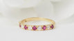 Bague 53 Demi-alliance en or jaune 18 kt, rubis et diamants 58 Facettes 32930