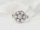 Bague 50 Bague marguerite en or blanc 18 kt et diamants 58 Facettes 33515