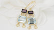 Boucles d'oreilles Boucles d'oreilles en or jaune 18 ct, aigue-marine et grenats 58 Facettes 31504