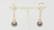 Boucles d'oreilles Boucles d’oreilles pendantes en or jaune 18 ct, diamants et perles de Tahiti 58 Facettes 32802