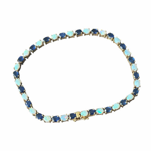 Bracelet Bracelet en or 18 carats serti de saphirs et opales 58 Facettes 344