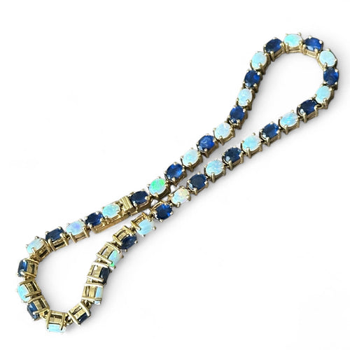 Bracelet Bracelet en or 18 carats serti de saphirs et opales 58 Facettes 344