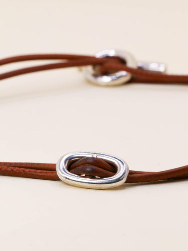 Collier Hermès Glenan - Collier en argent 925 et cuir marron 58 Facettes 1206.9